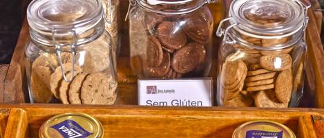 A display of food items in glass jars with labels indicating they are gluten-free and sugar-free.