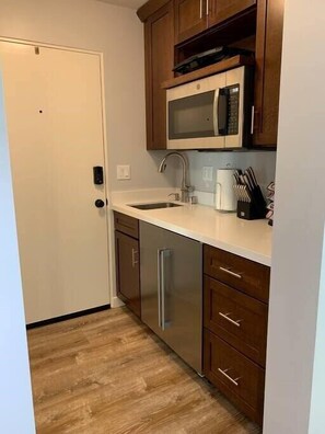 Fridge, microwave, coffee/tea maker, toaster