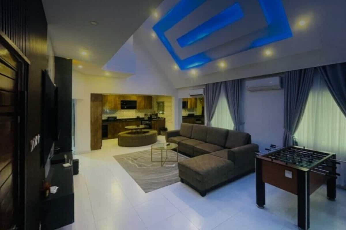 Luxury Apartment, 3 Bedrooms, Smoking, City View | Living area | 55-inch Smart TV with satellite channels, Netflix, streaming services