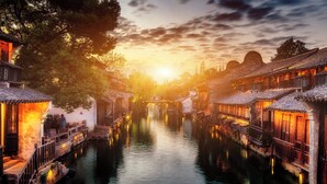 A traditional canal-side building with wooden walkways and a bridge. - Crowne Plaza Wuzhen by IHG (Jiaxing)