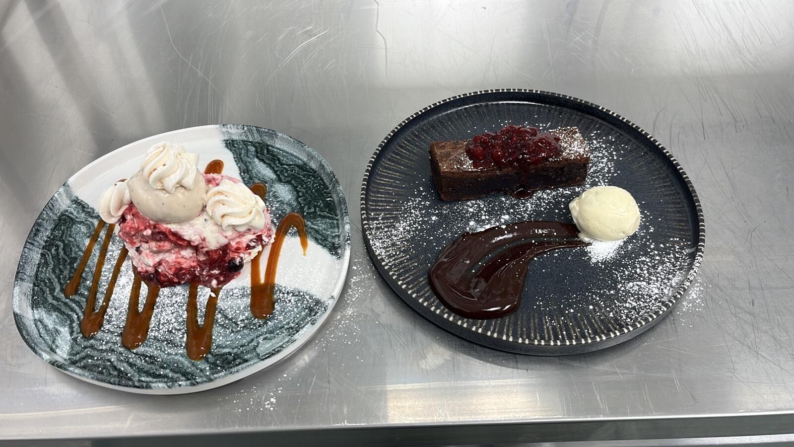 Two plates of dessert with caramel and chocolate sauce, one with a scoop of ice cream.