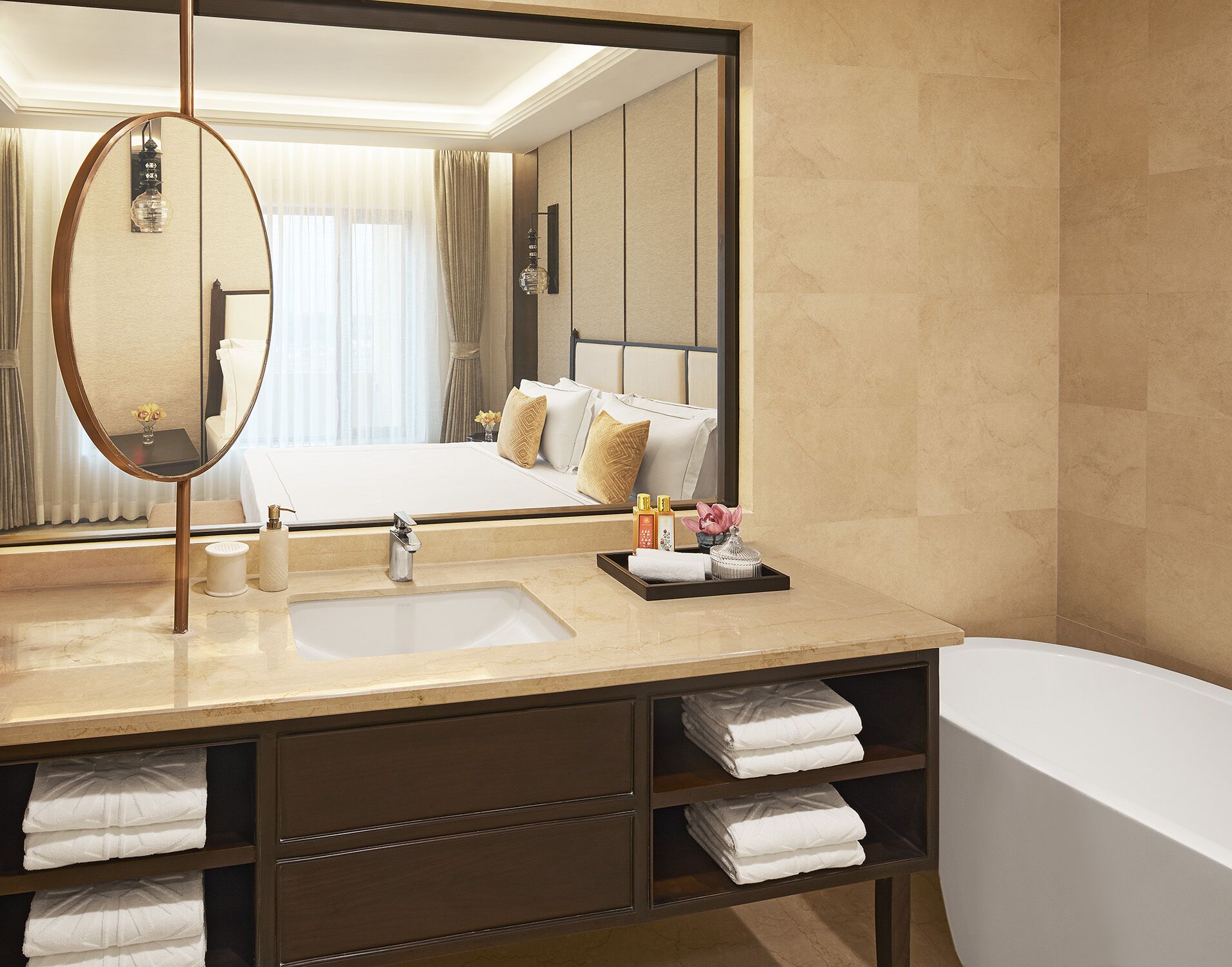 deluxe suite | bathroom | rainfall showerhead, designer toiletries, hair dryer, bathrobes