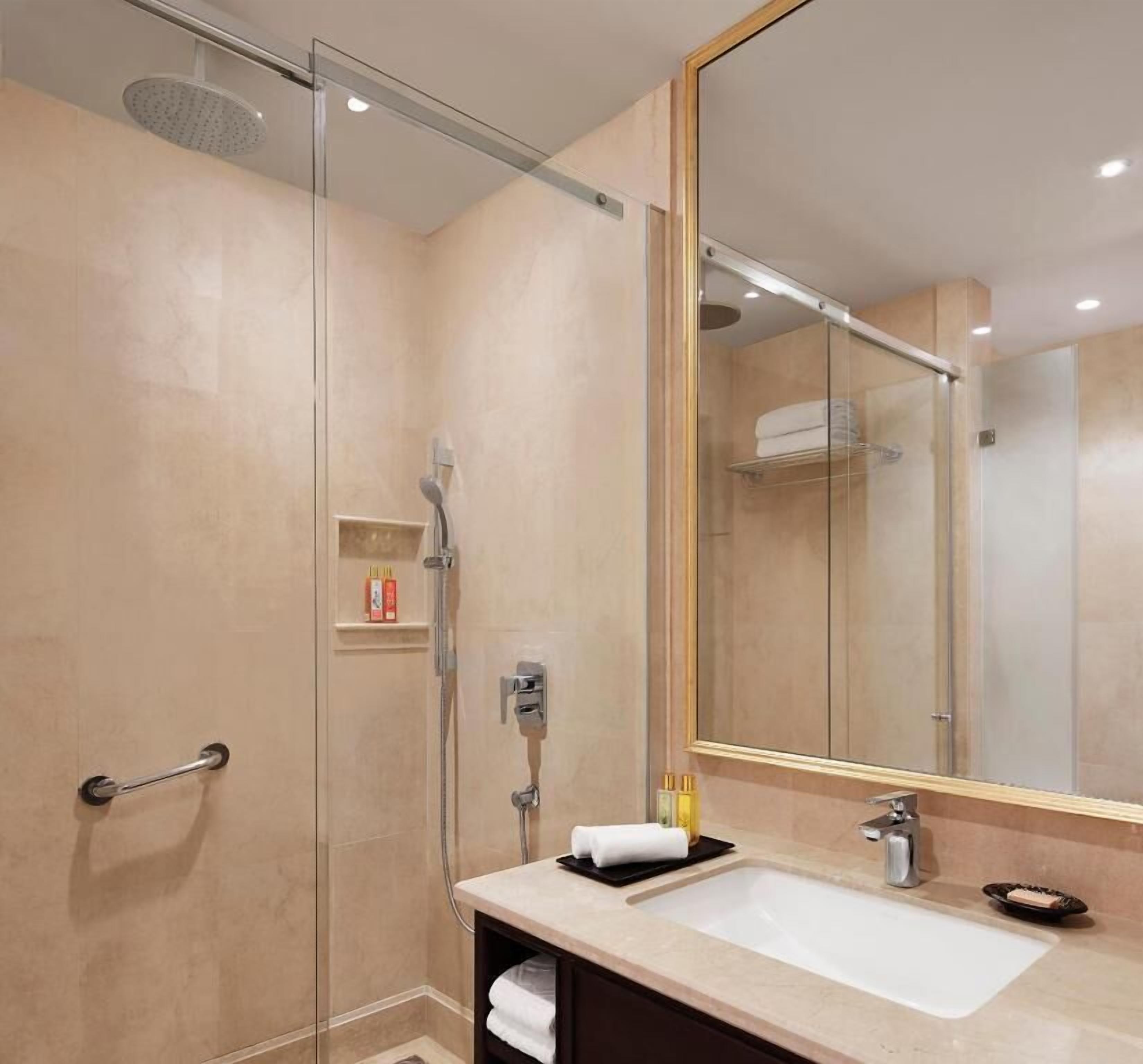 Bathroom | Rainfall showerhead, designer toiletries, hair dryer, bathrobes