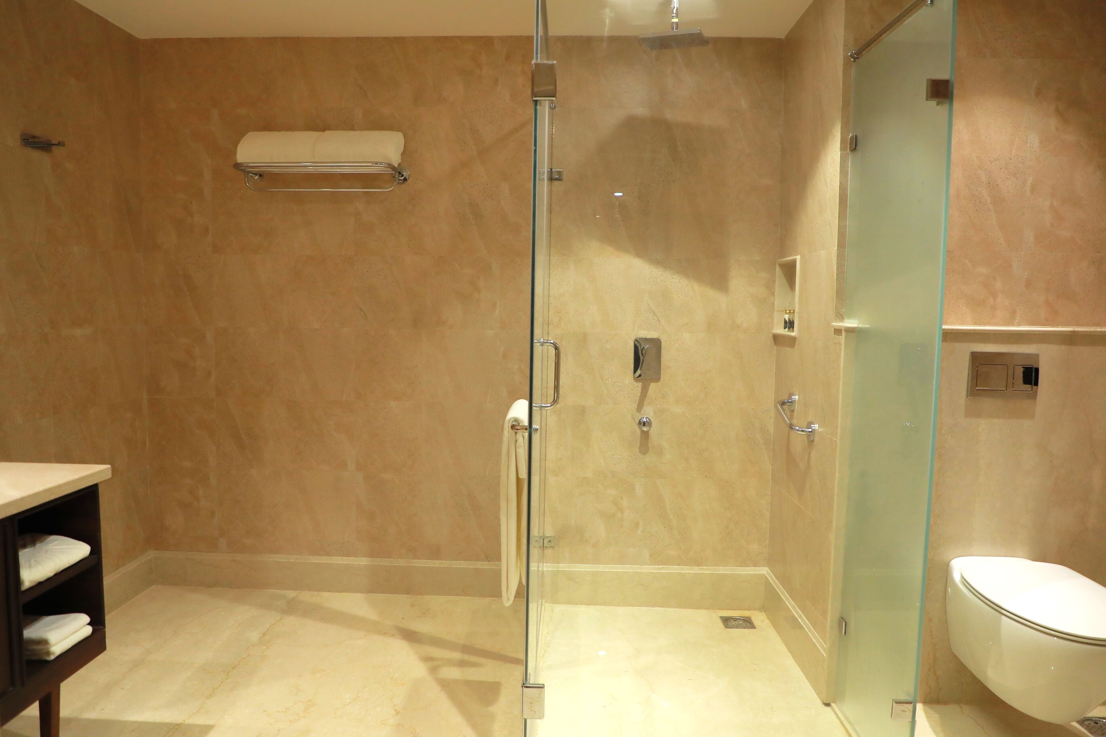 luxury room, 1 king bed | bathroom | rainfall showerhead, designer toiletries, hair dryer, bathrobes