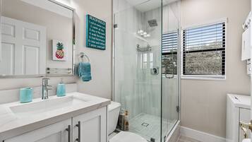 Combined shower/tub, hair dryer, towels, soap