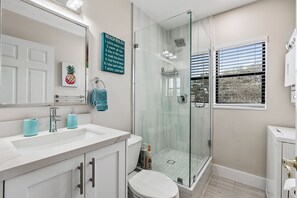 Combined shower/tub, hair dryer, towels, soap