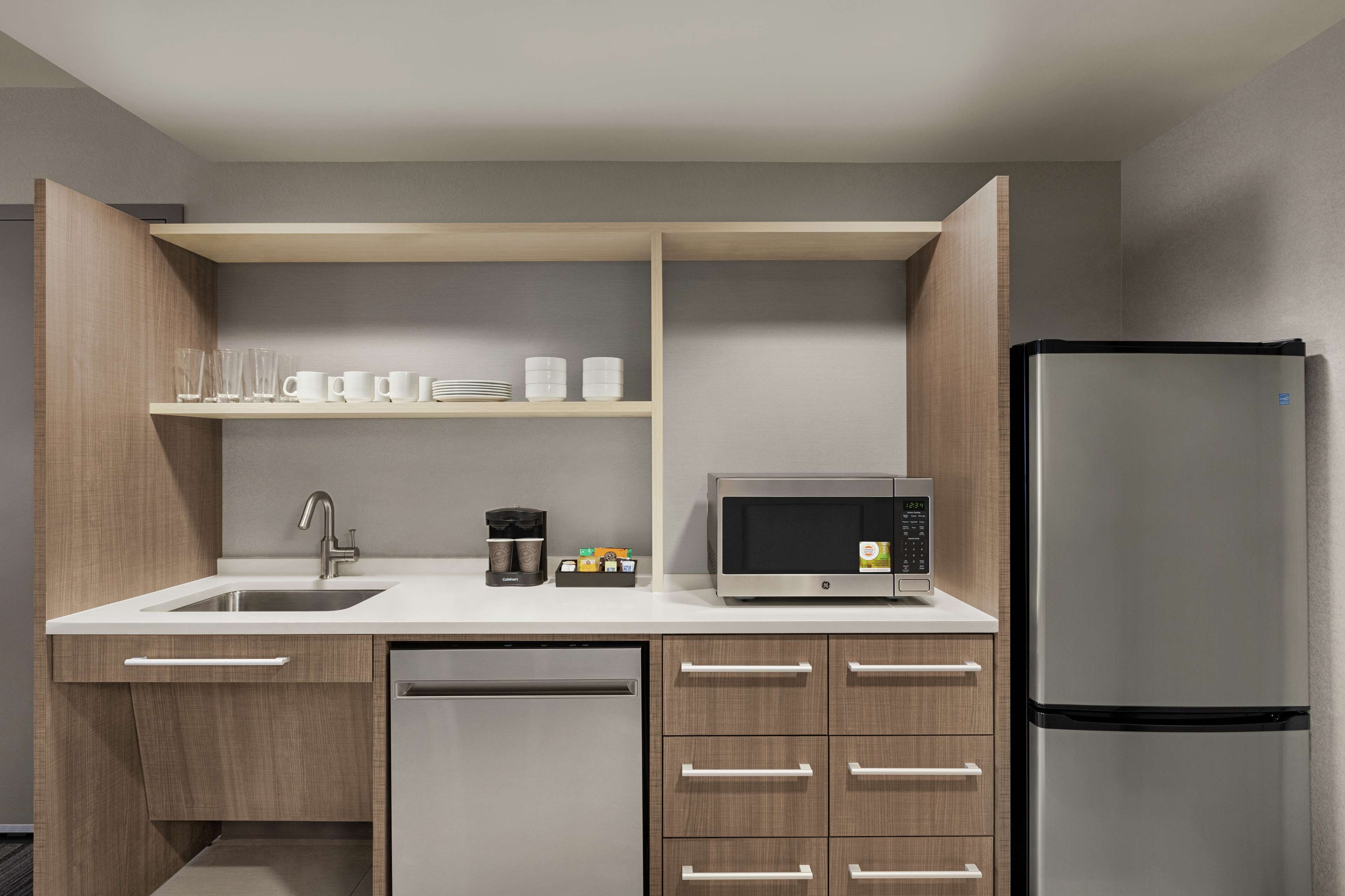 full-sized fridge, microwave, dishwasher, coffee/tea maker