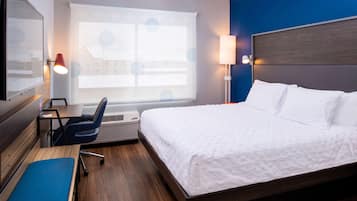 Desk, laptop workspace, blackout drapes, iron/ironing board