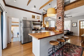 Enjoy cooking in this well-equipped kitchen with a central island and bar stools.