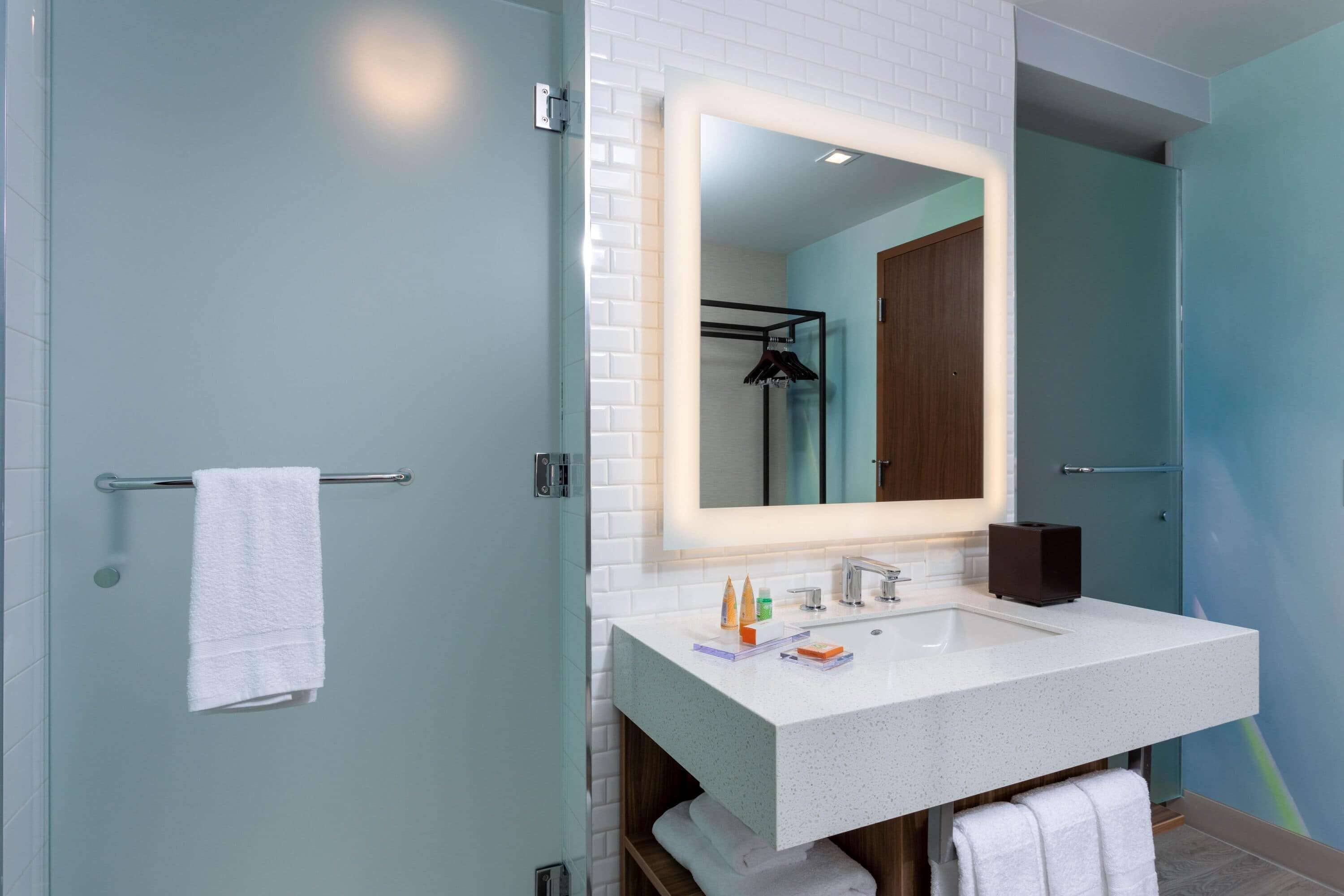 rainfall showerhead, designer toiletries, hair dryer, towels