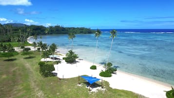 On the beach, white sand, free beach cabanas, sun loungers