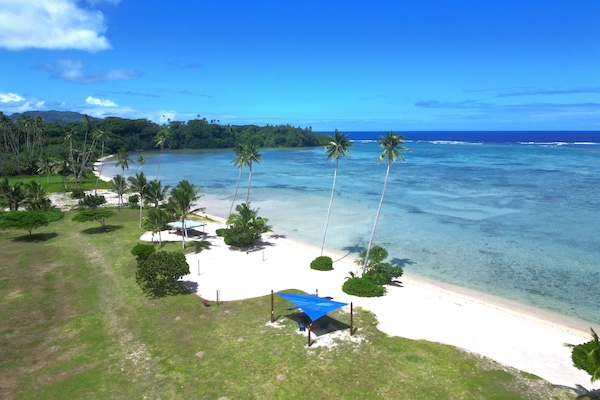 On the beach, white sand, free beach cabanas, sun loungers