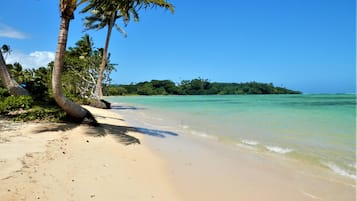 On the beach, white sand, free beach cabanas, sun loungers