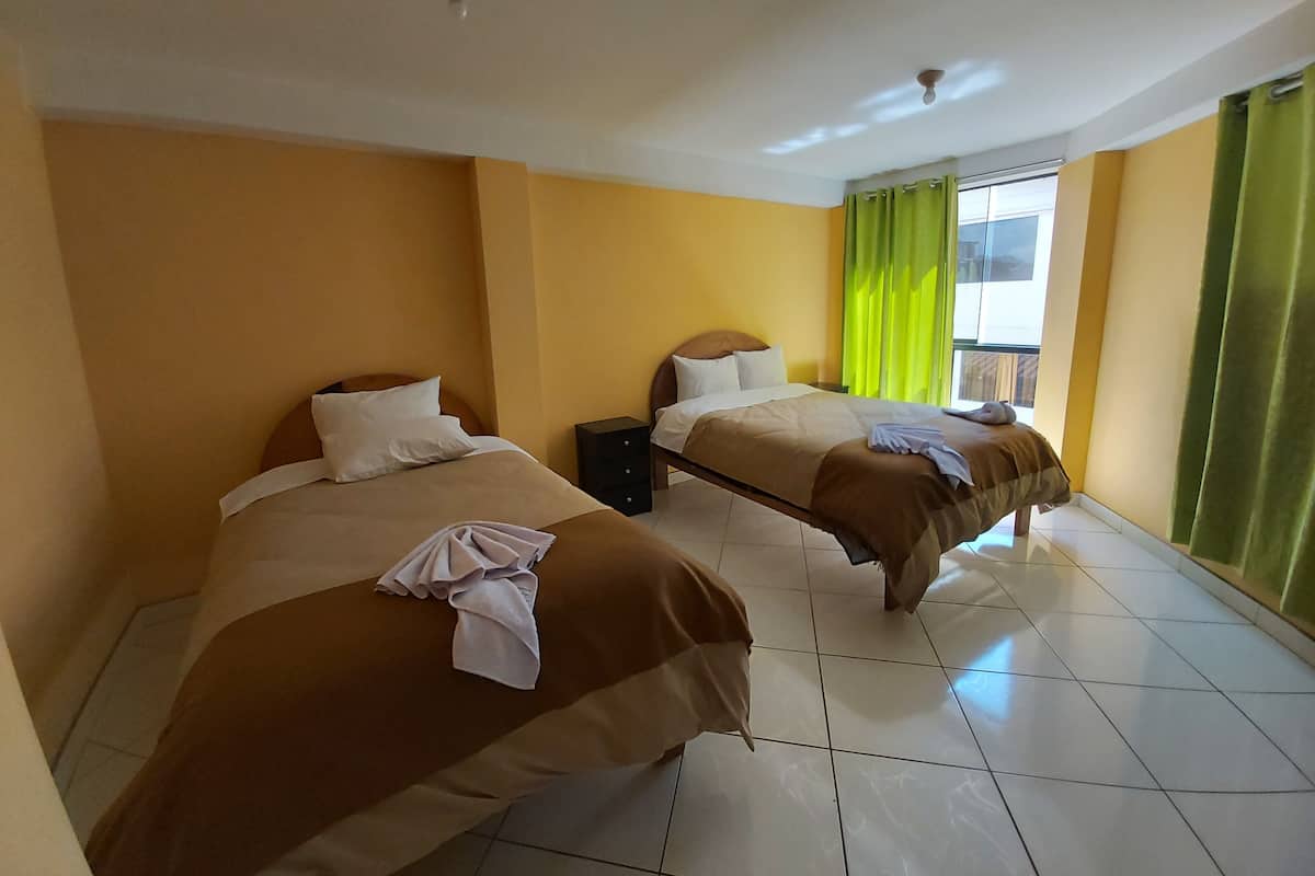 Family Triple Room | Down comforters, laptop workspace, WiFi, bed sheets