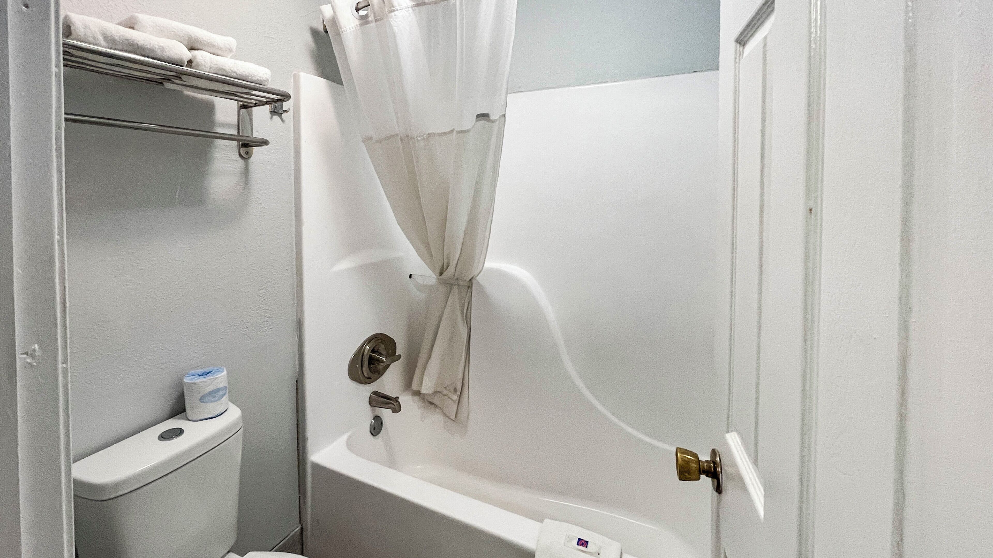 Shower, designer toiletries, hair dryer, towels