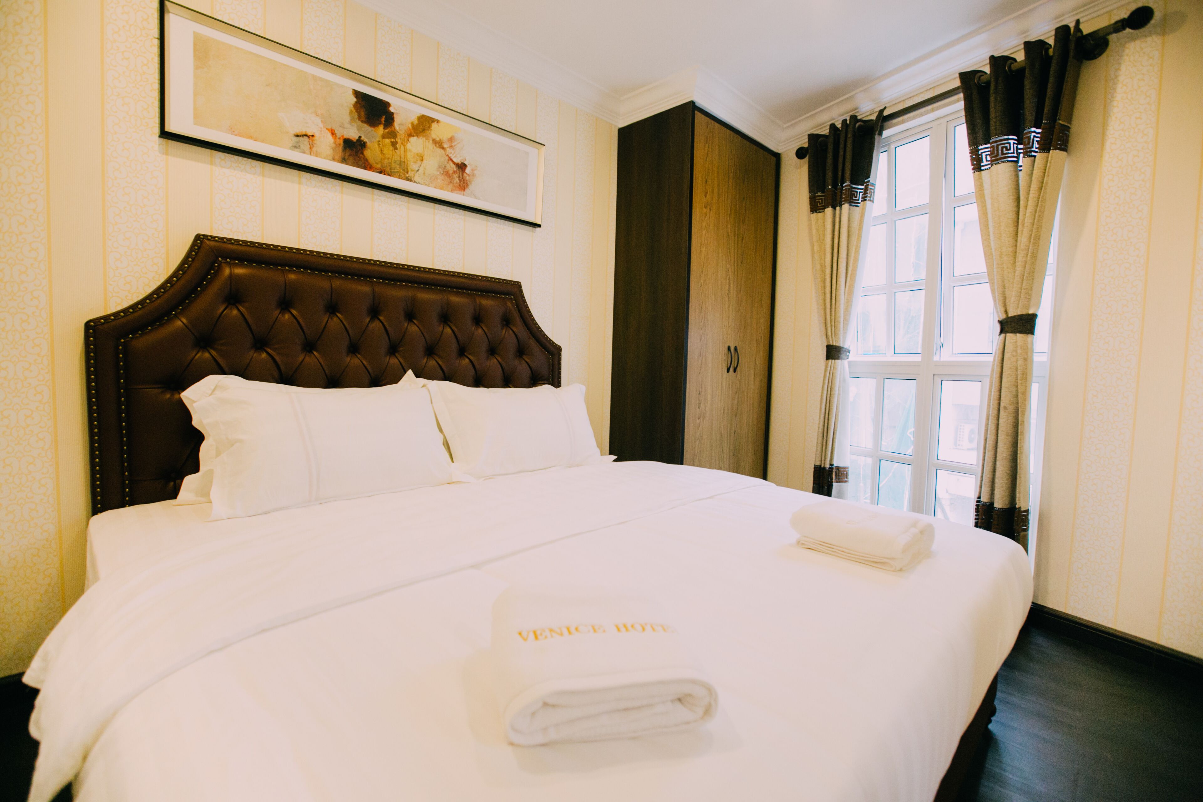 executive suite | in-room safe, laptop workspace, blackout curtains, iron/ironing board