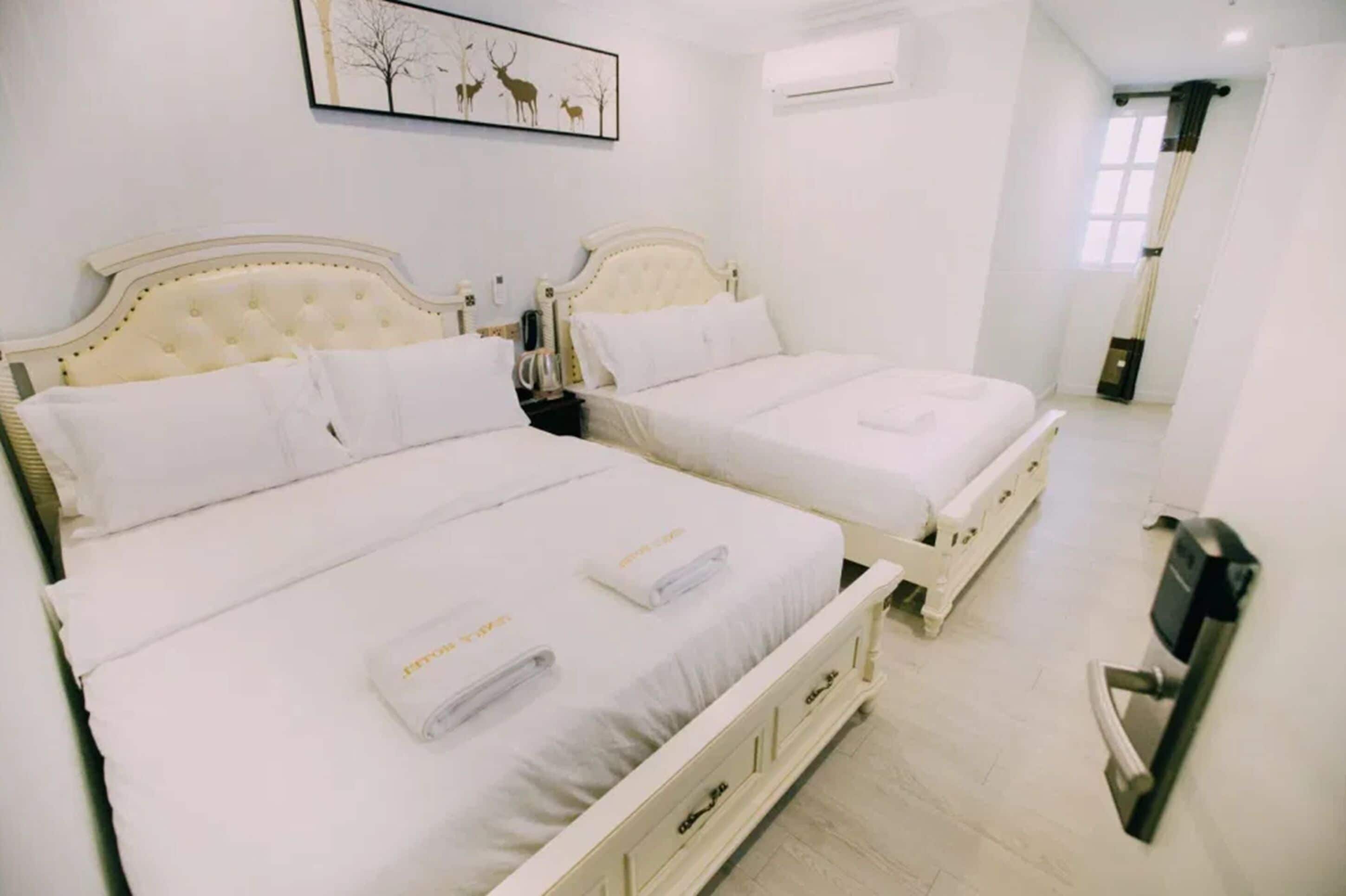 executive family suite | in-room safe, laptop workspace, blackout curtains, iron/ironing board