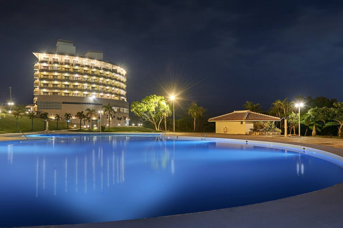 seasonal outdoor pool, open 9:00 am to 9:00 pm, pool umbrellas