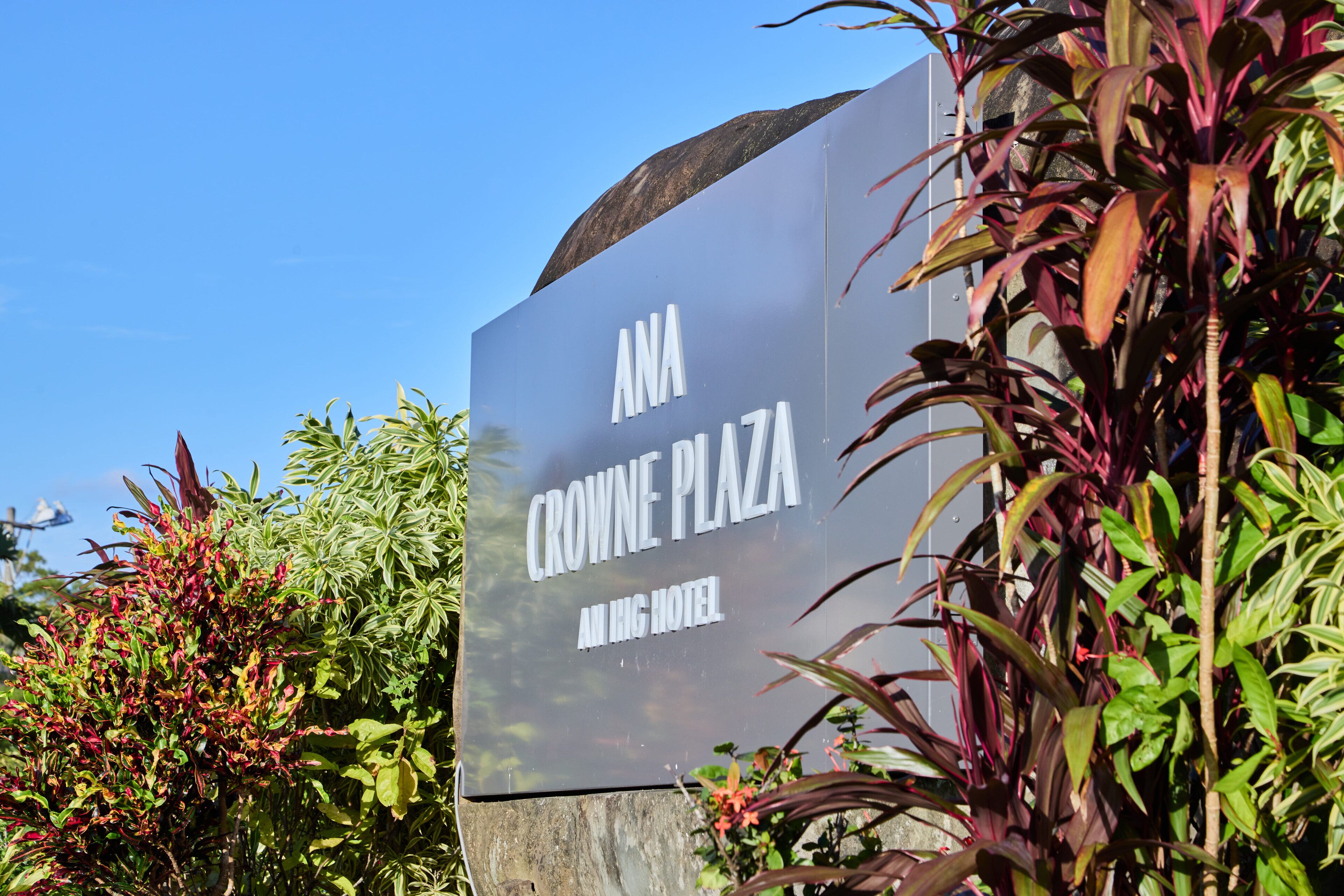 A sign for Crowne Plaza All In Hotel.