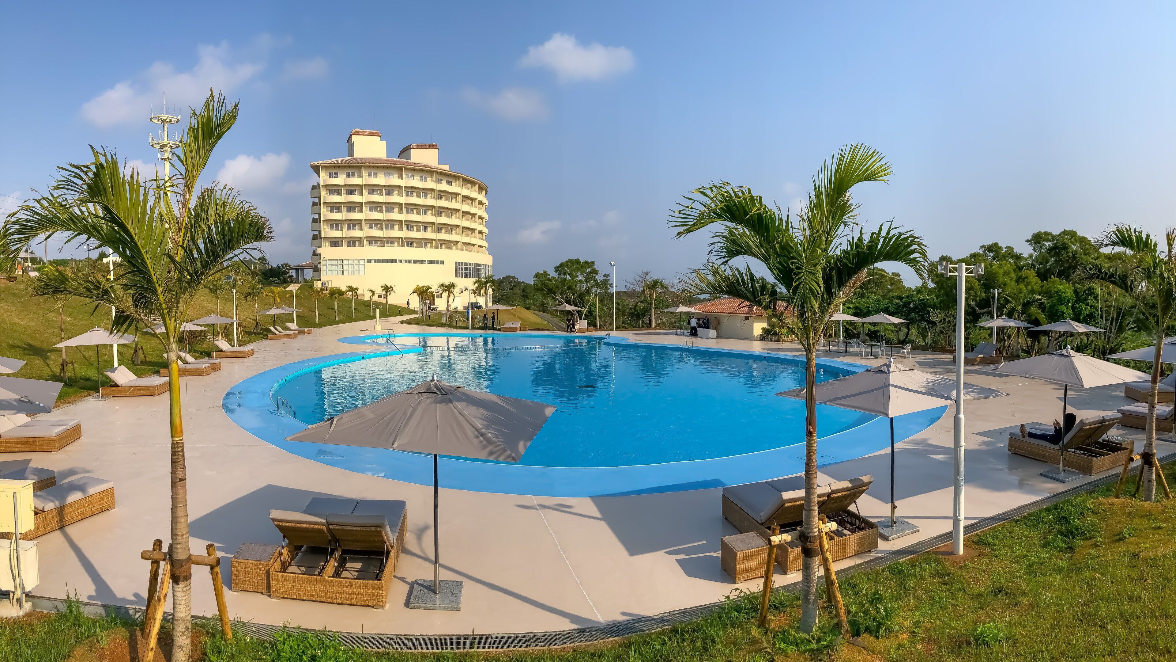 Seasonal outdoor pool, open 9:00 AM to 9:00 PM, pool umbrellas