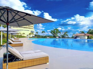 Seasonal outdoor pool, open 9:00 AM to 9:00 PM, pool umbrellas - ANA Crowne Plaza Resort Okinawa Uruma Hills by IHG (Uruma)