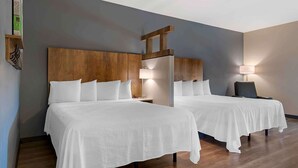 A hotel room with two beds, wooden headboards, and bedside lamps. - Extended Stay America Premier Suites Savannah Pooler (Pooler)