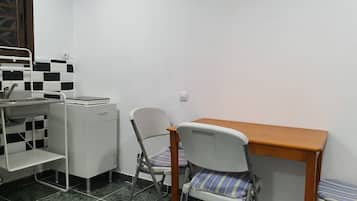 Twin Room, Shared Bathroom | Living area | Flat-screen TV