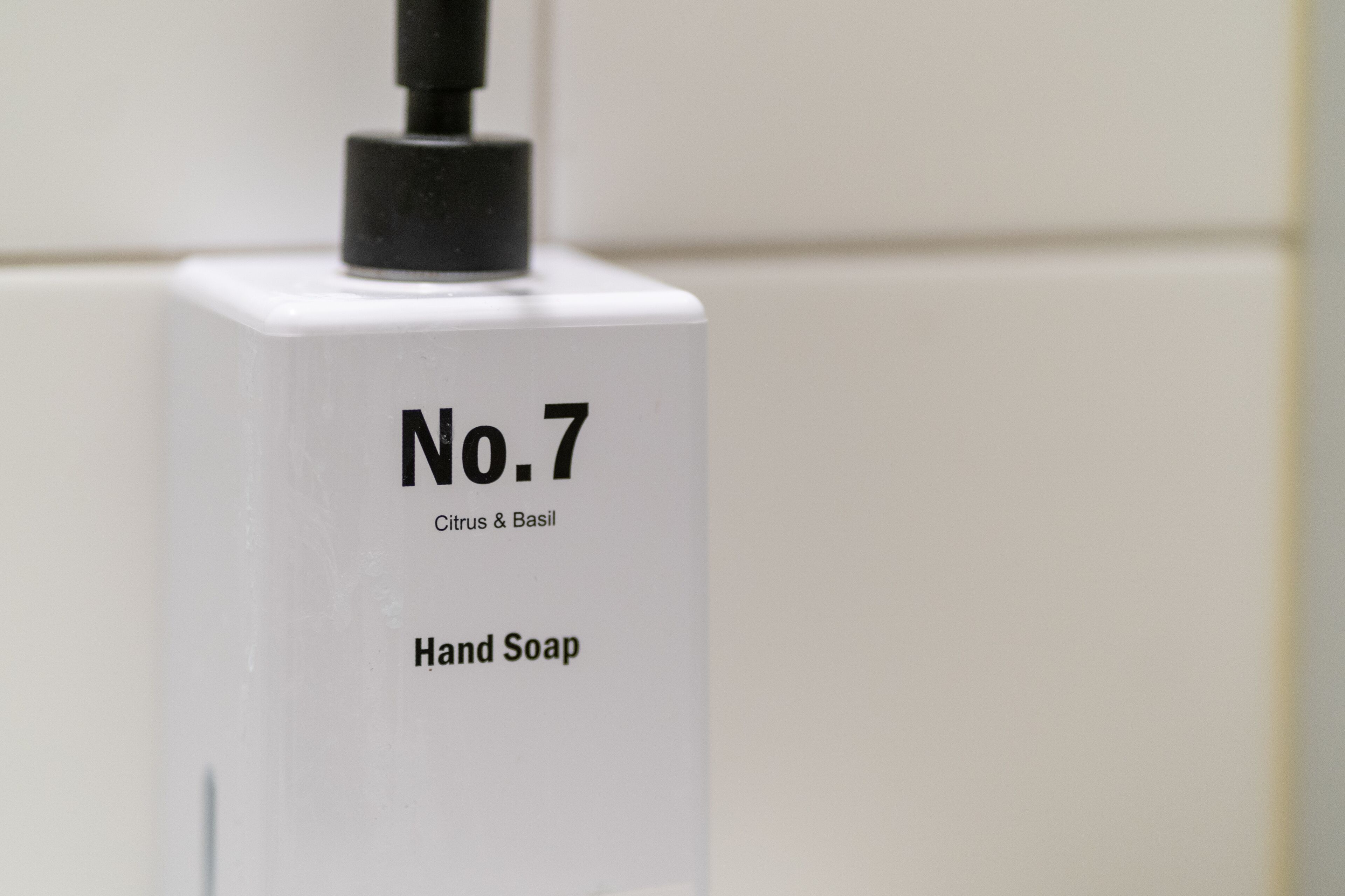 compact medium (no windows) | bathroom | hair dryer, towels, soap, shampoo