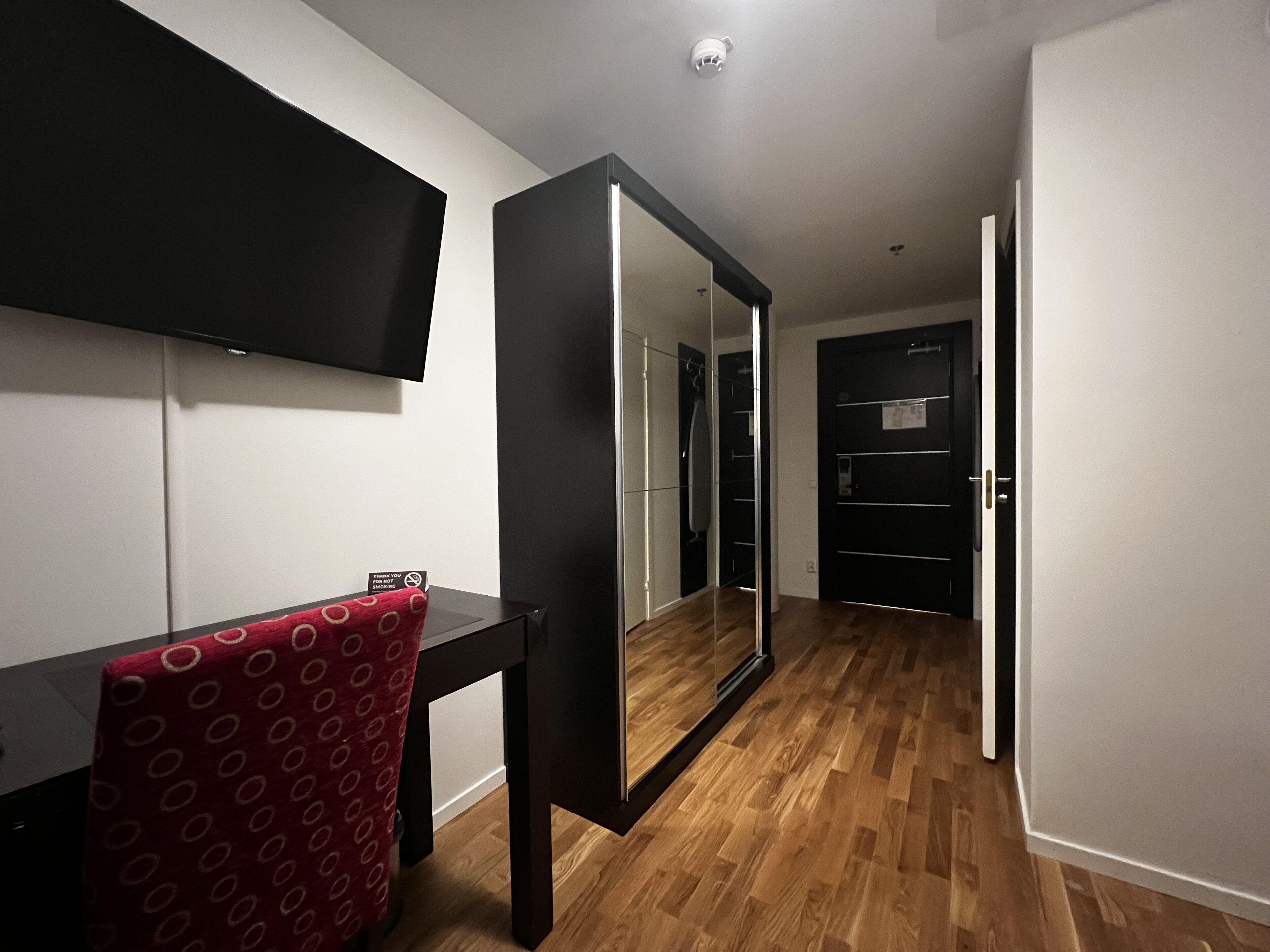 compact medium (no windows) | living area | flat-screen tv