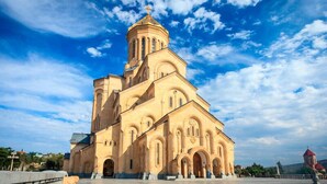 A large, historic church with a prominent bell tower and multiple arches. - BARNOVI BOUTIQUE HOTEL (Tbilisi)