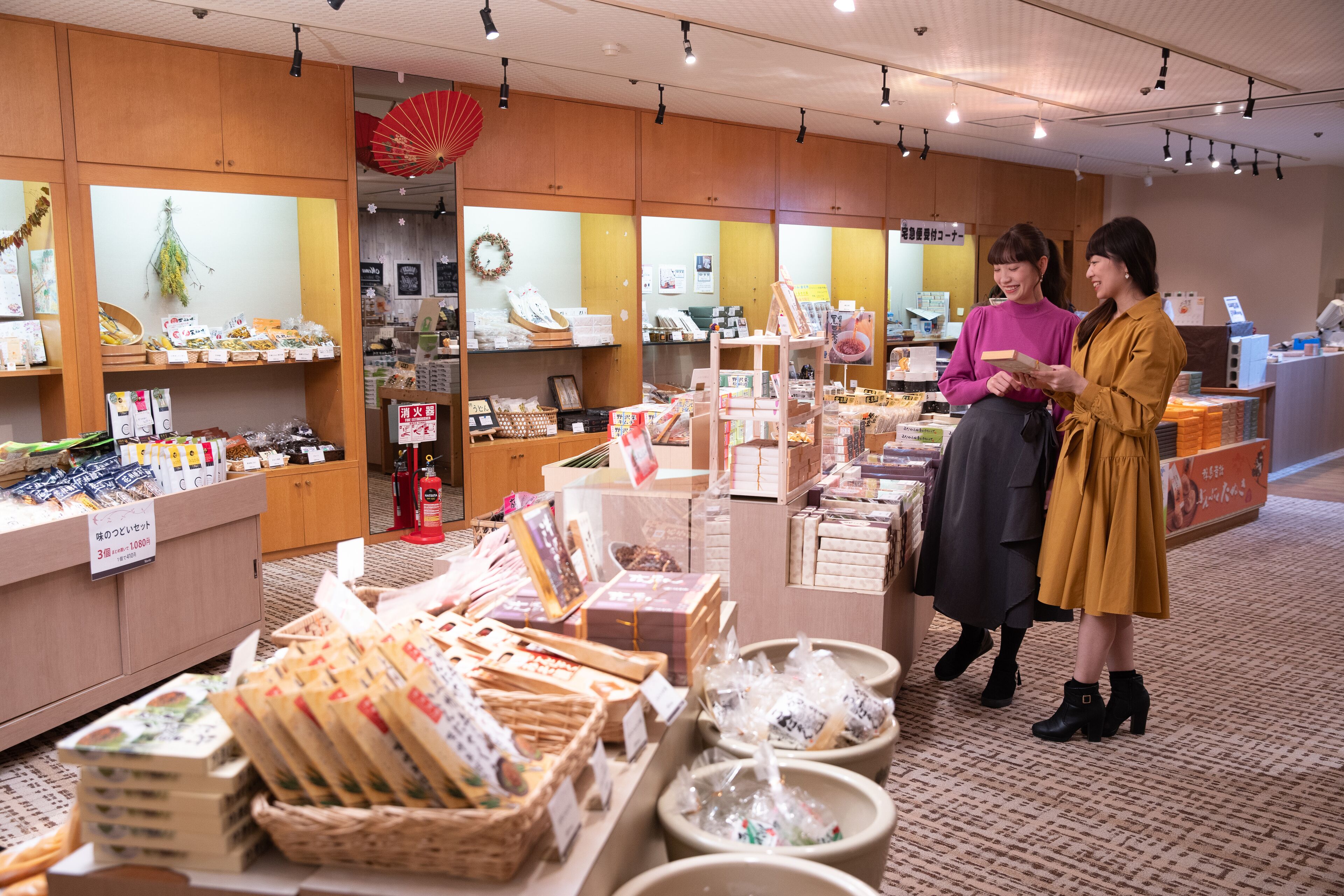 A store with wooden shelves and a variety of packaged goods.