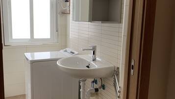 Shower, rainfall showerhead, towels, soap