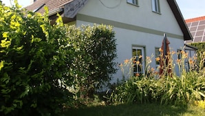 A house with a satellite dish, a window, and a solar panel. - 89820 Fw 2 - 89820 Holiday apartment 2 (Malchow)