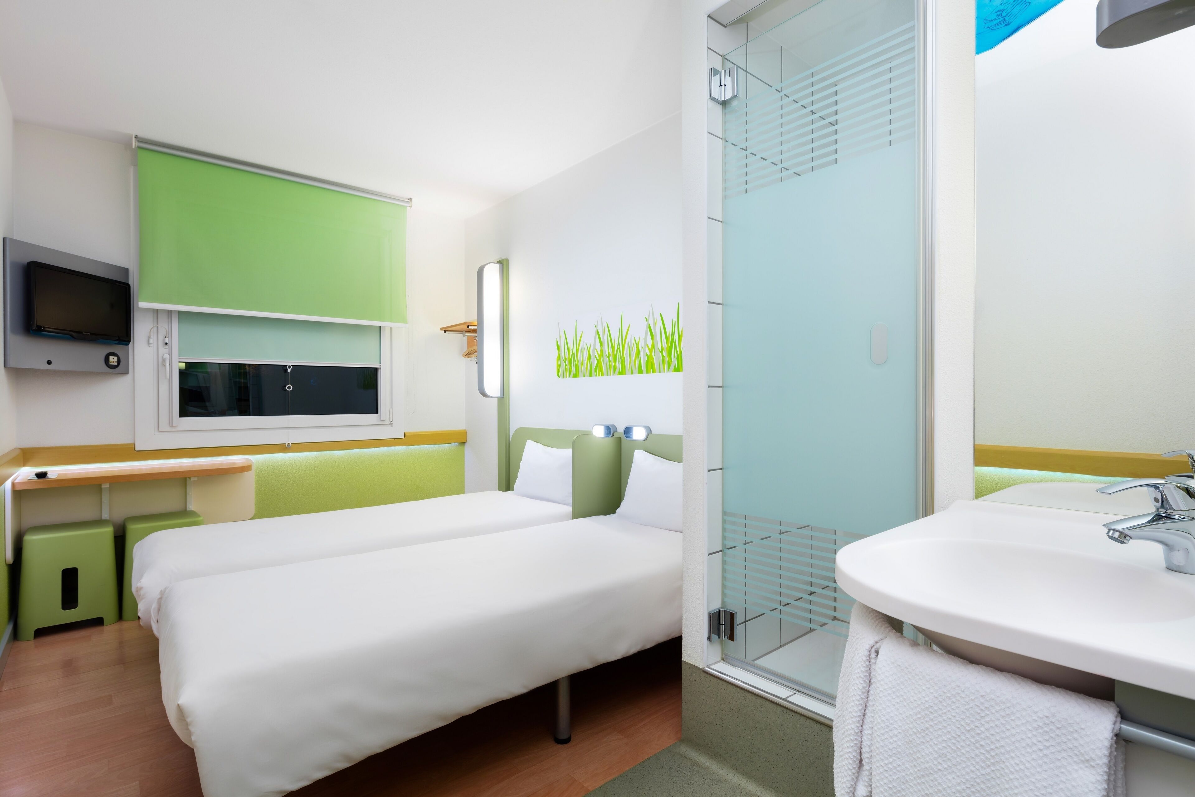 basic twin room, 2 single beds | bathroom | shower, eco-friendly toiletries, towels
