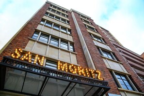 A building with a prominent illuminated sign reading 'SAN MARY'S'.