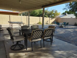 Seating for 6 under a large covered patio