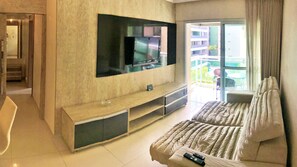 Apartamento executivo | Sala de estar | TV LCD