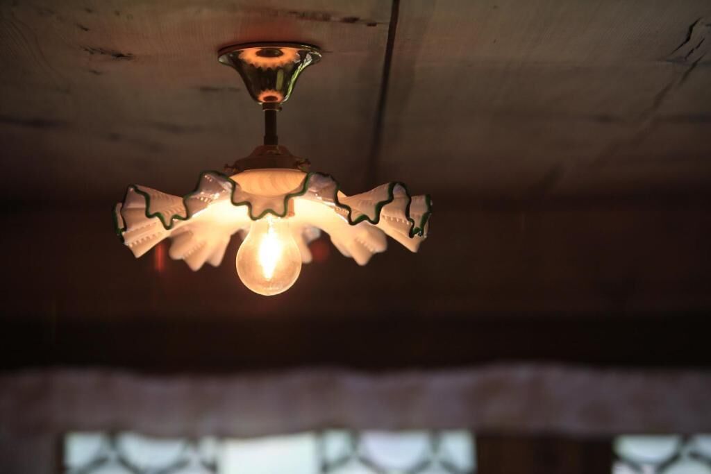 A ceiling light fixture with a unique, scalloped design.
