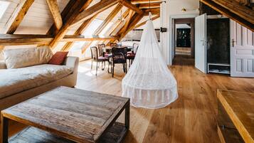 Family Studio Suite (Marie) | Living area | Flat-screen TV