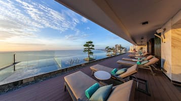 Outdoor pool, open 6:00 AM to 9:00 PM, pool loungers