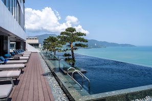 Outdoor pool, open 6:00 AM to 9:00 PM, pool loungers
