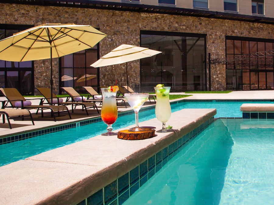 Outdoor pool, free pool cabanas, pool umbrellas