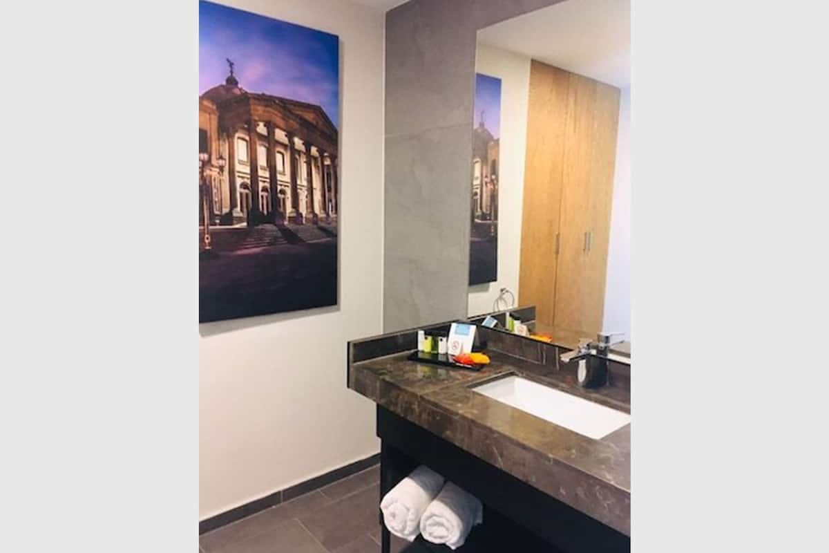 suite, 1 king bed, non smoking (master suite) | 1 bedroom, in-room safe, individually furnished, desk