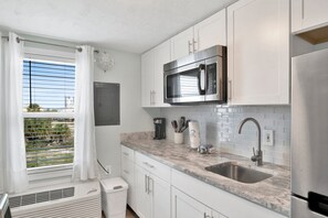 Fridge, microwave, coffee/tea maker, toaster