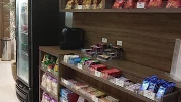 A snack display with various packaged goods in a store.