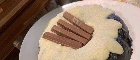 A dessert with chocolate pieces on top.