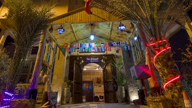 A building entrance with a sign reading "Tim Joseph's Ghost House". - Tin Joseph (Ouarzazate)