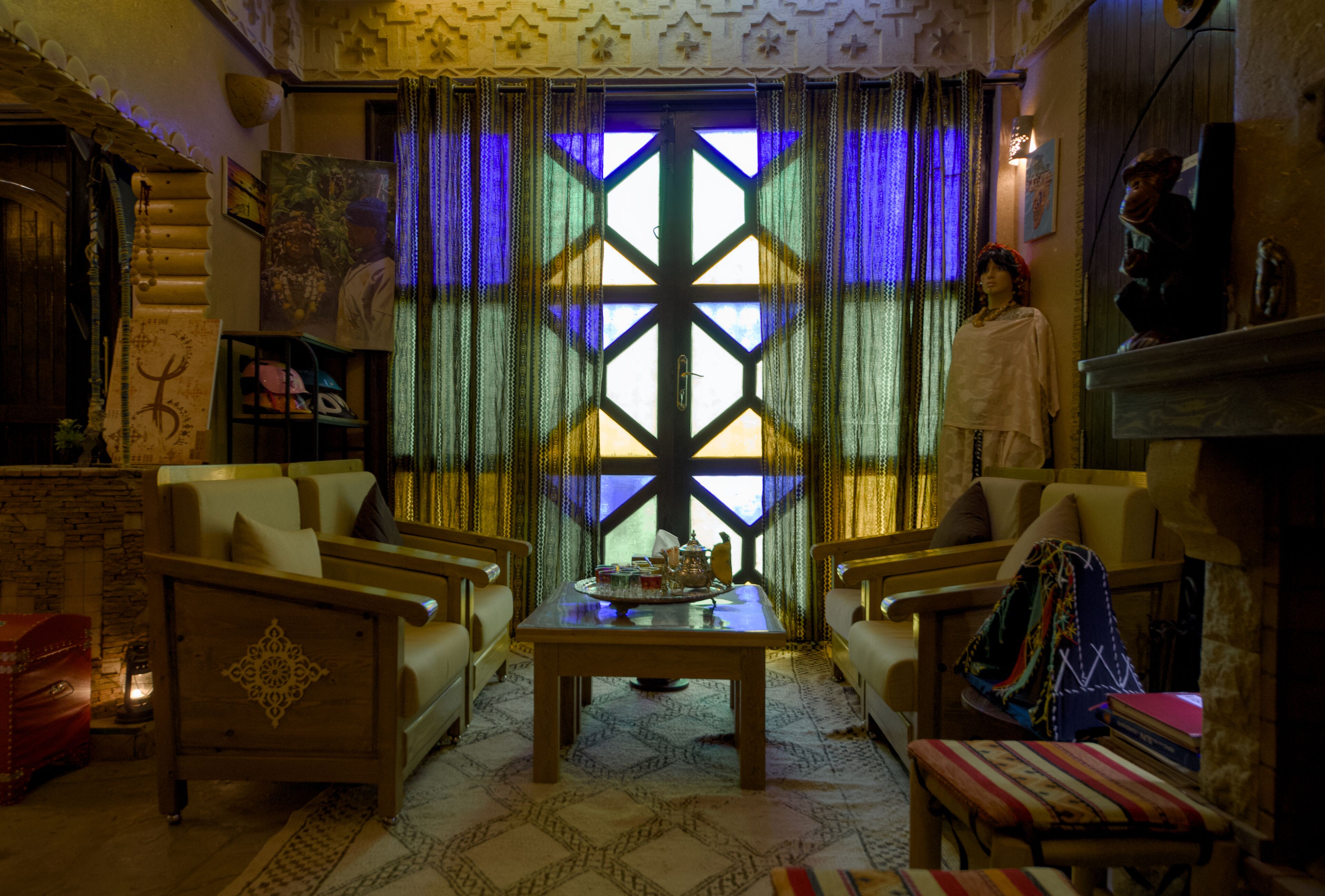 A cozy living room with a wooden coffee table, two sofas, and a patterned rug.