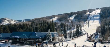 A ski resort with a chairlift, groomed trails, and a building labeled 'Eagle Bahn Gondola 19'.