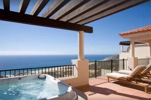 A hot tub on a balcony with a view of the ocean. - Luxury Private Villa Overlooking Ocean (Cabo San Lucas)